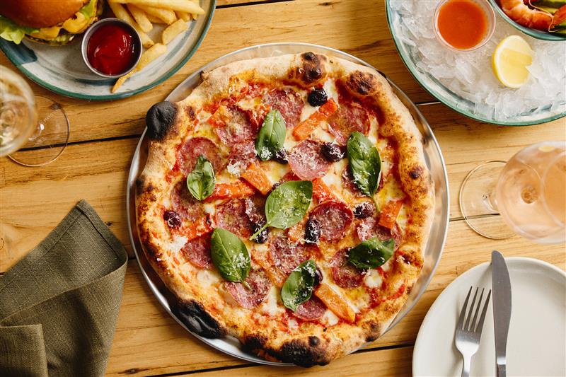 The new pizza program uses long-fermented dough made with sustainably grown wheat from the Tamworth wheat belt.